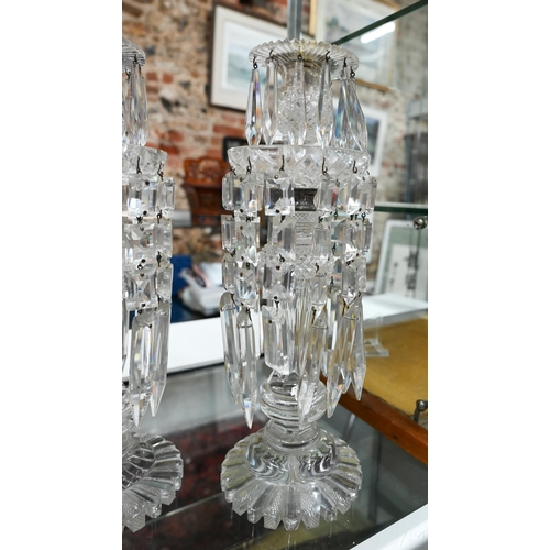 168 - Pair of antique cut glass candlesticks, hung with facetted prism drops, 34 cm high (one a/f)