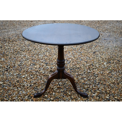 261 - A Georgian style mahogany tilt top table raised on a birdcage tripod base, 83 cm dia. x 74 cm h