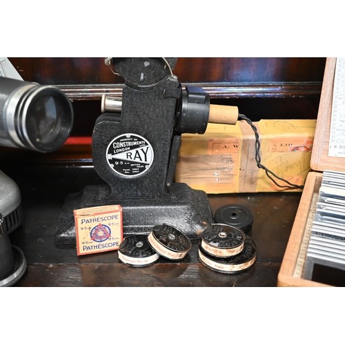 271 - A vintage Noris Plank slide projector kit to/w a 'Ray' cine projector and reels (2)