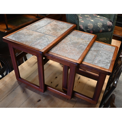 274 - A nest of three tiled top tables to/w a green Lloyd Loom chair