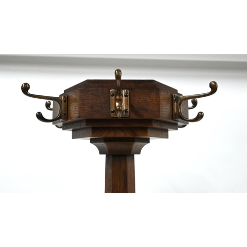 276 - An Arts & Crafts period oak hall stand with brass hooks and stick/umbrella retaining brackets, o... 