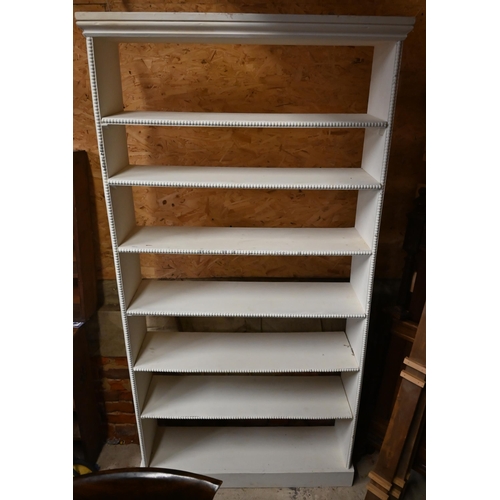 277 - A white painted open bookcase, 100 cm x 28 cm x 195 cm h