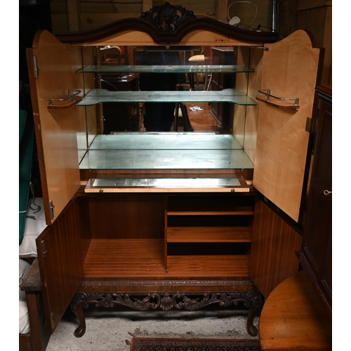 293 - A Queen Anne style walnut cocktail cabinet, part mirror fitted interior, raised on carved cabriole l... 