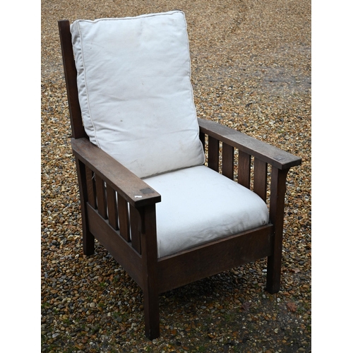 295 - An Art Deco period oak ladderback armchair, with seat cushions