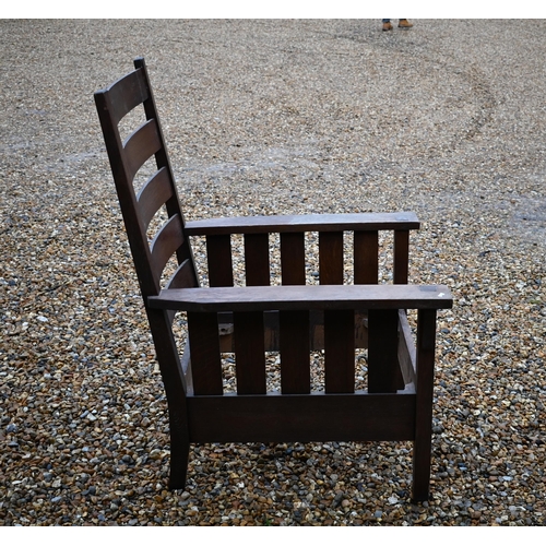 295 - An Art Deco period oak ladderback armchair, with seat cushions