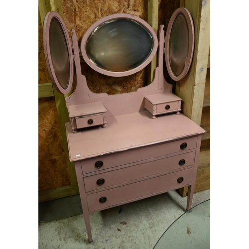 31 - #A pink painted mirror backed three drawer dressing chest, raised on square tapering legs, on cerami... 