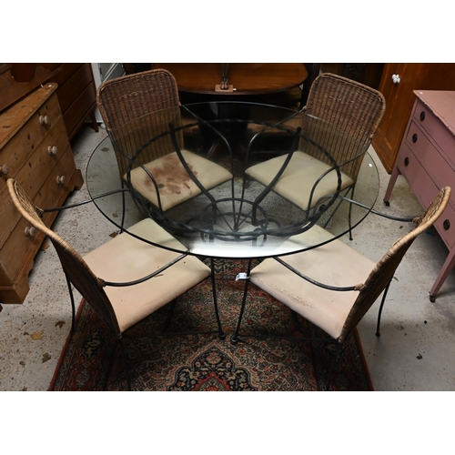 34 - A contemporary circular glass top wrought steel framed dining table to/w a set of four steel framed ... 