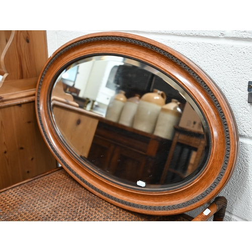 373 - A bevelled oval wall mirror with egg and dart carved mahogany frame 78 cm x 50 cm to/w another bevel... 