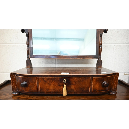 378 - A 19th century mahogany toilet mirror on bow front three drawer platform base with bun feet 55 cm w ... 