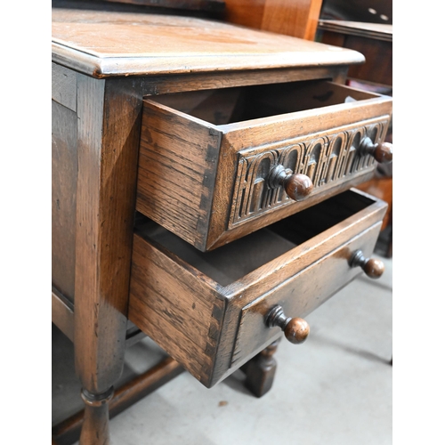 382 - An Old Charm style carved oak bedside table with two drawers 50 cm w x 34 cm d x 72 cm h 