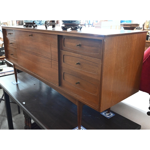 395 - A Grange, London mid century teak sideboard with fall-front cupboard and six drawers, raised on tape... 