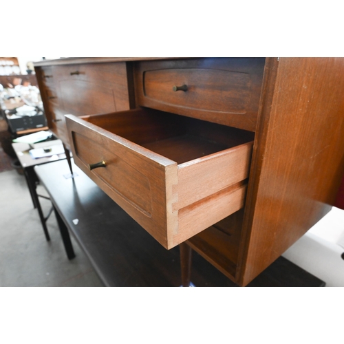 395 - A Grange, London mid century teak sideboard with fall-front cupboard and six drawers, raised on tape... 