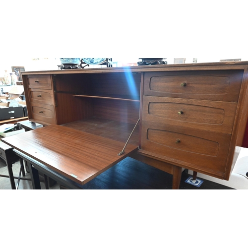 395 - A Grange, London mid century teak sideboard with fall-front cupboard and six drawers, raised on tape... 