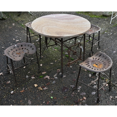 4 - An artisan designed reclaimed agricultural component garden dining set comprising a circular stonecr... 