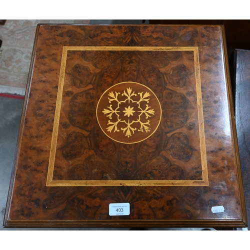 403 - A small inlaid walnut revolving bookcase on cruciform base with casters 46 cm x 46 cm x 78 cm h