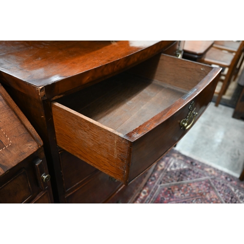 404 - A 19th century mahogany bowfront chest of two short over three long drawers raised on cut-down/reduc... 