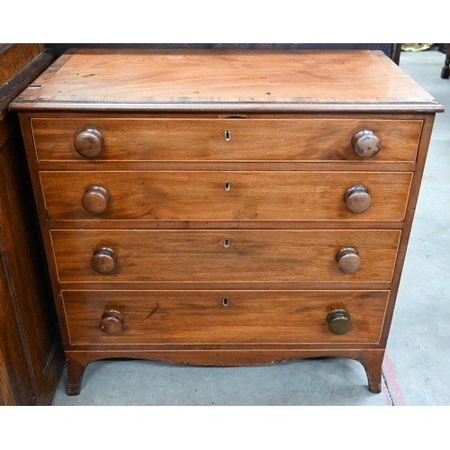 408 - A small Victorian mahogany chest of four long graduating drawers with turned handles, raised on spla... 