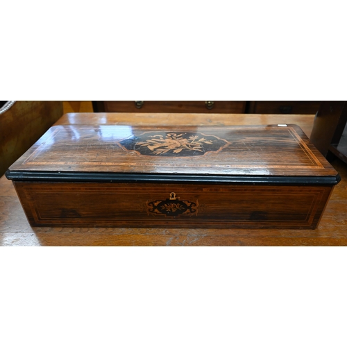 409 - A 19th century rosewood and marquetry music box (mechanism removed) inlaid with musical instrument m... 