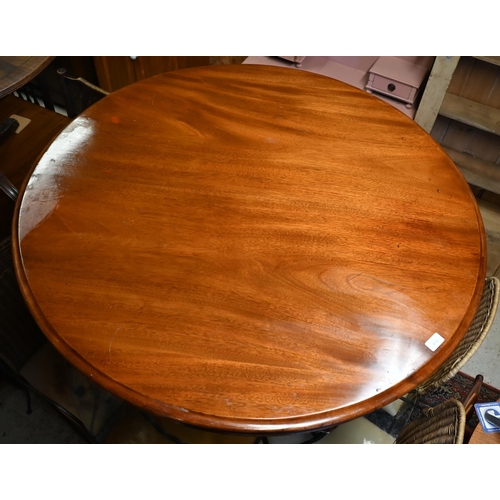 412 - A Victorian mahogany circular tilt-top breakfast table raised on a turned column and scrolling trifo... 