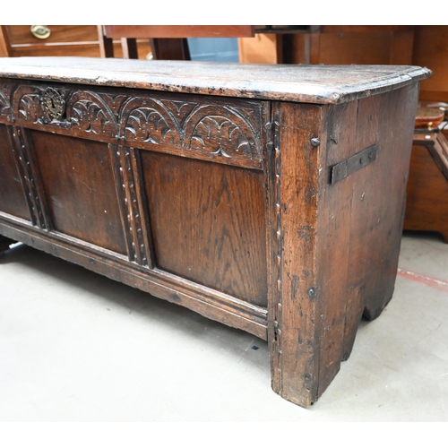 413 - An antique carved oak coffer 120 cm w x 46 cm d x 55 cm h 