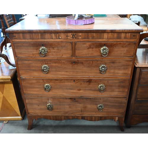 414 - A 19th century mahogany chest of two short over three long drawers with brass handles raised on spla... 