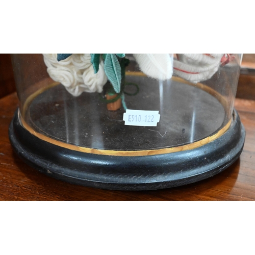 417 - A Victorian wool-work flower arrangement centre piece on circular ebonised base with glass dome ... 