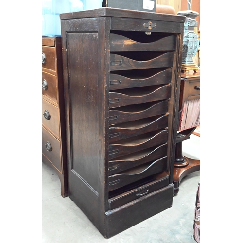 419 - An early 20th century oak tambour front filing cabinet with nine drawers (in saleroom 2 office) 46 c... 