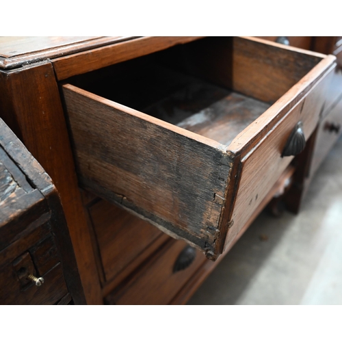 422 - A hardwood chest of two short over two long drawers with cupped shell cast handles