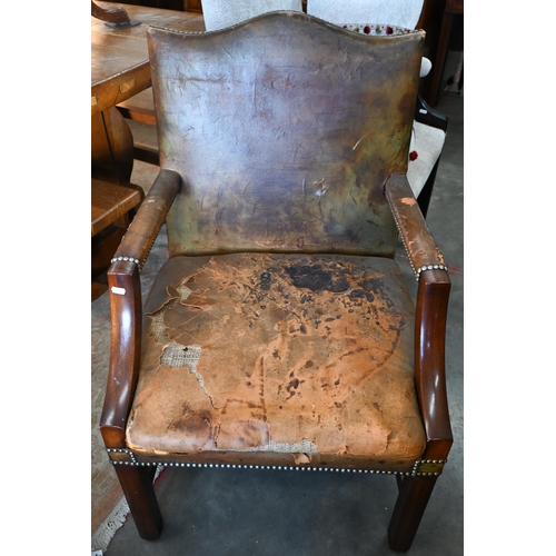 428 - A mahogany framed Gainsborough style armchair with studded brown leather upholstery (F/R) 