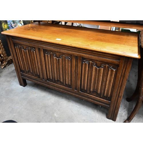 440 - An oak coffer with linenfold carved triple panel front, 114 cm wide x 50 cm deep x 64 cm high