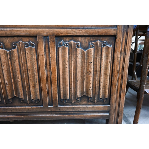 440 - An oak coffer with linenfold carved triple panel front, 114 cm wide x 50 cm deep x 64 cm high