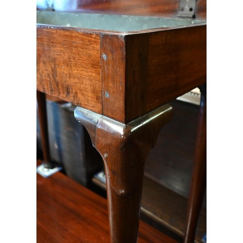 455 - A 19th century mahogany plant table with hinged top enclosing zinc lined interior, on turned pad foo... 