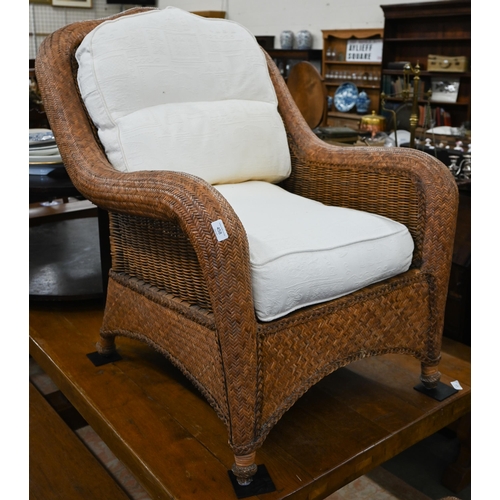 458 - A rattan and wicker framed conservatory armchair to/w matching side table