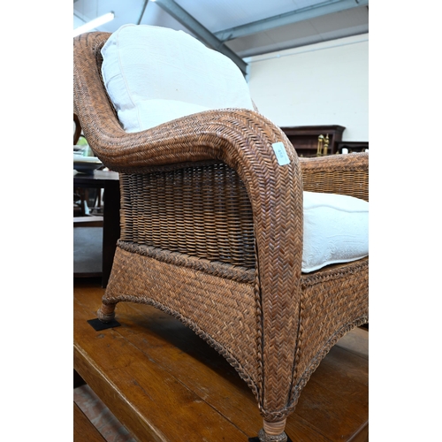 458 - A rattan and wicker framed conservatory armchair to/w matching side table