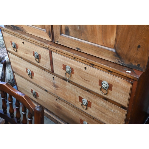 460 - A 19th century mahogany linen press with panelled doors enclosing slides over two short and two long... 