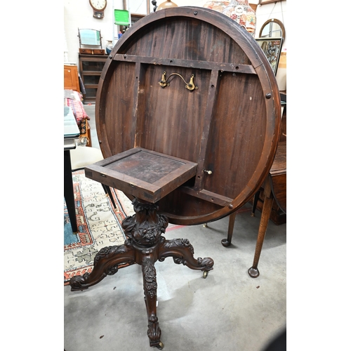 464 - A Victorian mahogany circular tilt-top table with floral and foliate carved base with baluster colum... 