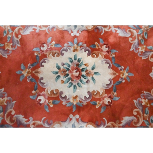 466 - A Chinese cut wool floral design rug, 183 x 122 cm