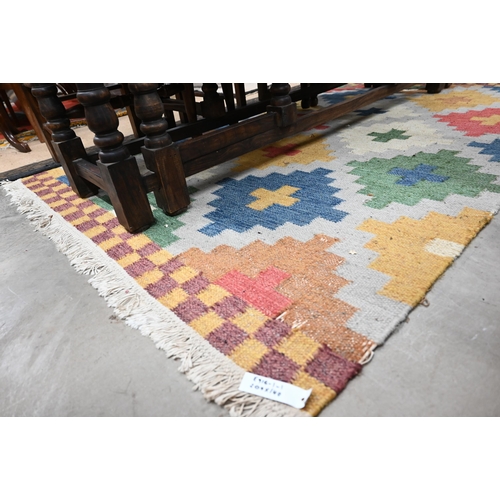 467 - A multi-coloured geometric design kelim rug, 200 x 140 cm