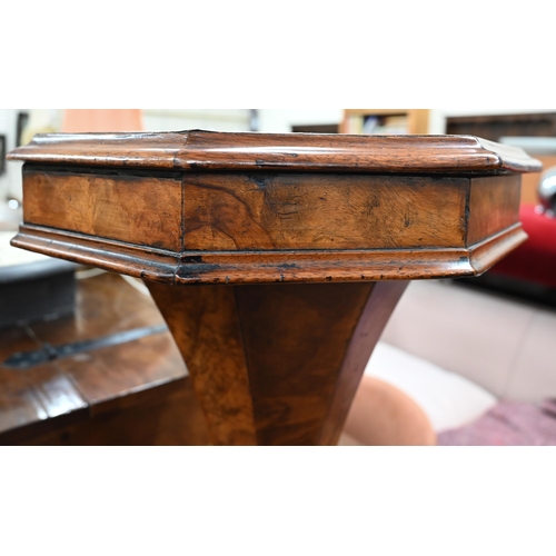 475 - A Victorian walnut octagonal sewing table with fitted silk lined interior tapering column and trifor... 