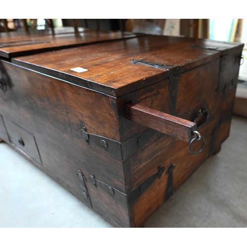 484 - An Indian rosewood and iron bound wedding chest/coffee table with hinged tri-panelled top, 110 x 60 ... 