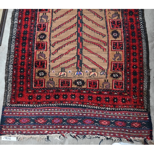 488 - A Persian Baluch tan ground rug, flora and fauna designs and red border with kelim ends, 190 x 94 cm