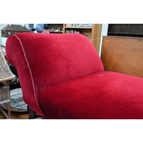 491 - A Victorian mahogany framed scroll end chaise longue with scarlet velvet upholstery, a/f