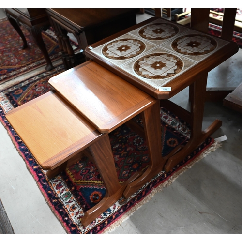 493 - A nest of three 1970s teak tables, the largest with inset tile-top to/w Old Charm style nest of oak ... 