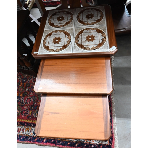 493 - A nest of three 1970s teak tables, the largest with inset tile-top to/w Old Charm style nest of oak ... 