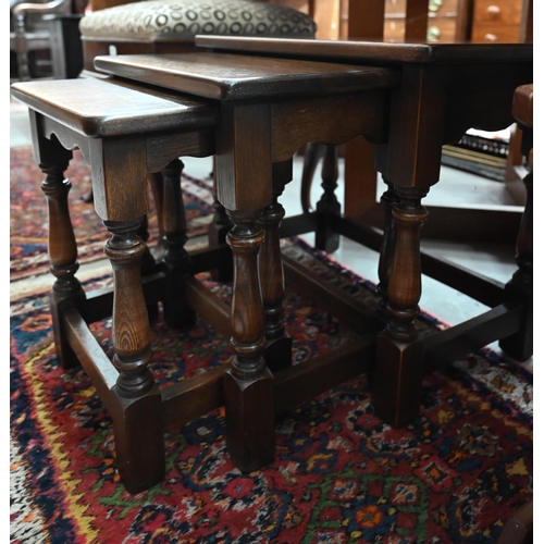 493 - A nest of three 1970s teak tables, the largest with inset tile-top to/w Old Charm style nest of oak ... 