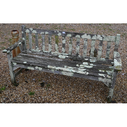 5 - A heavily weathered teak garden bench to/with a pair of equally weathered teak chairs (3)