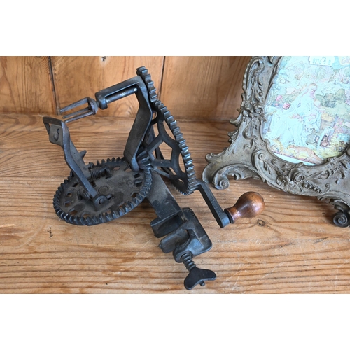 515 - Antique hand-cranked apple peeler to/w bronzed easel frame in the Rococo taste (2)