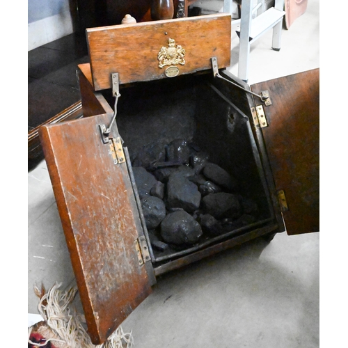 520 - Late Victorian walnut coal-box, the mechanical-opening doors with floral-embossed copper panels, to/... 