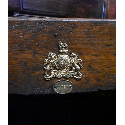 520 - Late Victorian walnut coal-box, the mechanical-opening doors with floral-embossed copper panels, to/... 