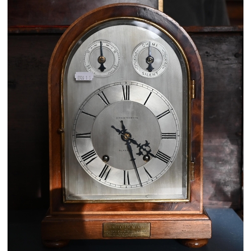 552 - An early 20th century arched mahogany mantel clock, silvered dial 'Aird & Thompson, Glasgow' sig... 